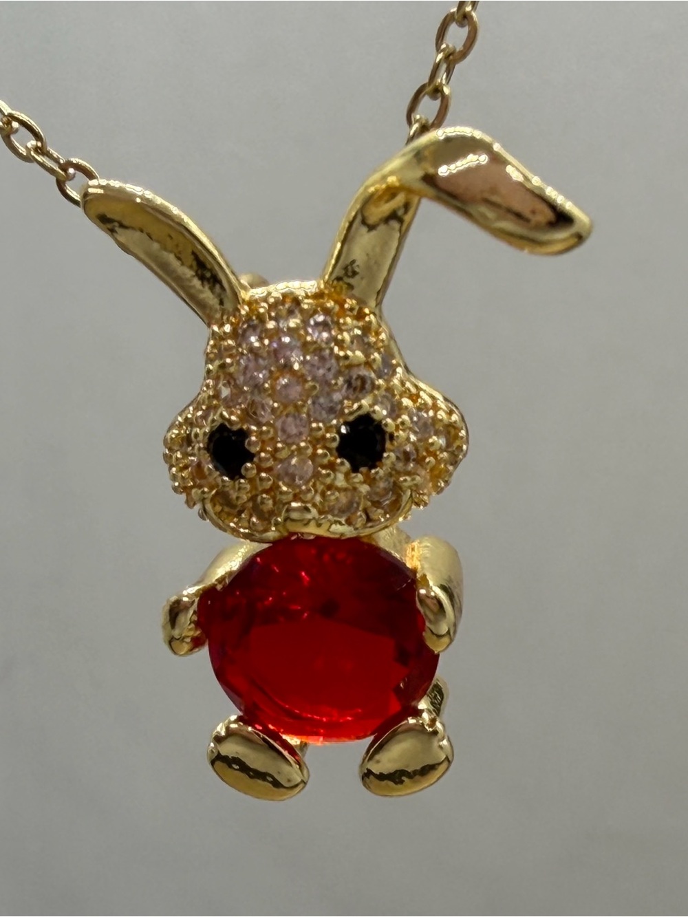 Gold Bunny Pendant Necklace with Red Crystal Accent